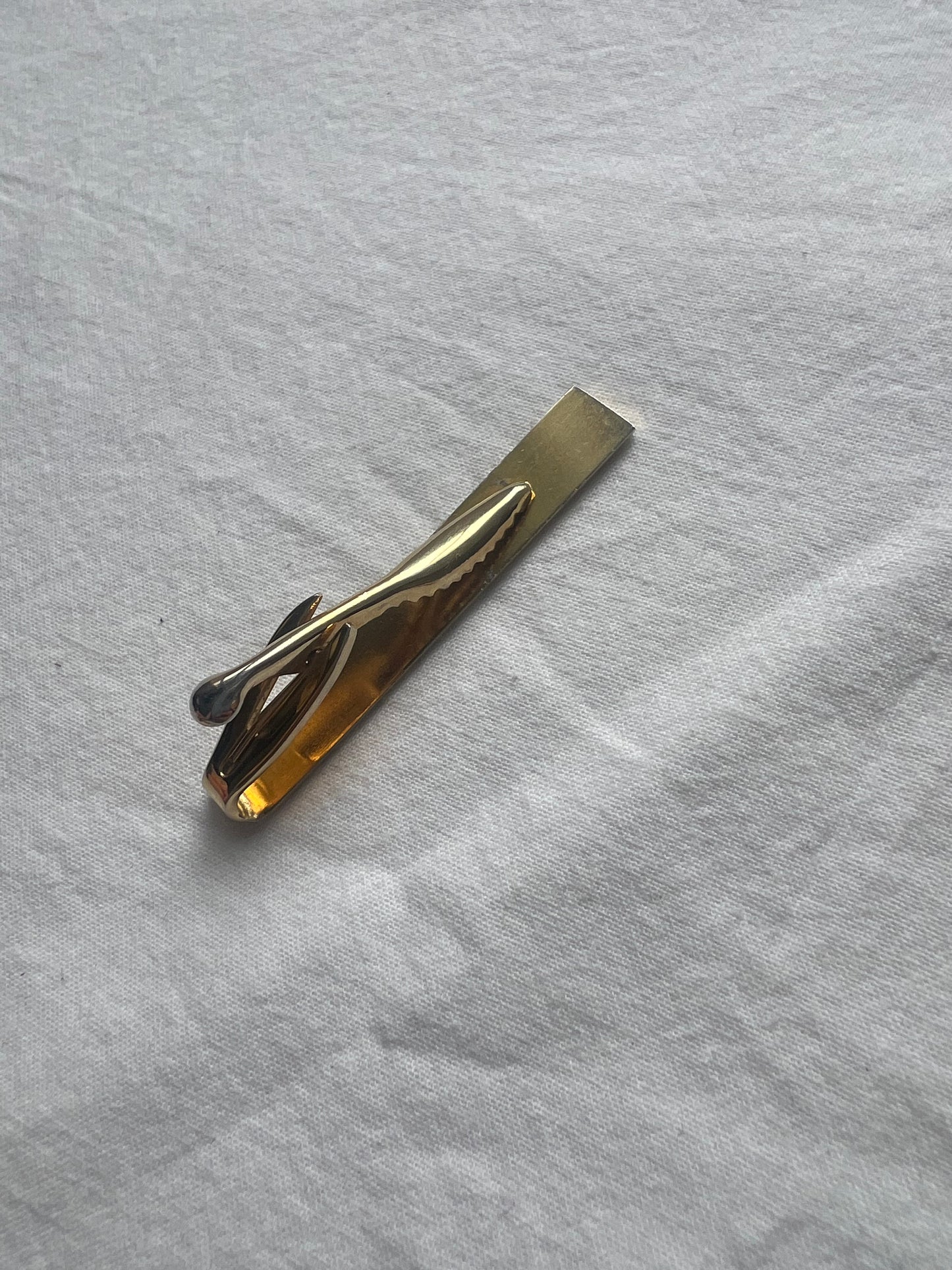 Gold embossed tie clip