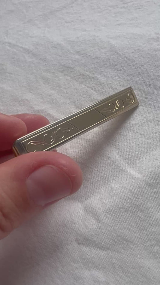 Gold embossed tie clip